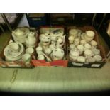 Three trays of ceramic ware to include cups, saucers, coffee pots, etc