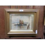 A gilt framed and glazed watercolour of sailing vessels signed bottom left