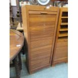 An early 20th century stationery cabinet with tamber front