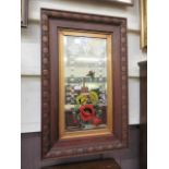 A carved oak framed bevel glass mirror with a floral design