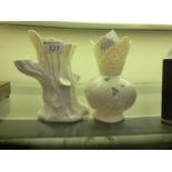 Two white ceramic vases by Belleek with nature design