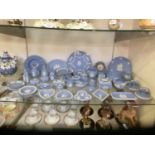 A large selection of Wedgwood Jasperware to include cream jug, plates, bud vases, etc