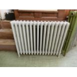 A cast iron radiator painted grey