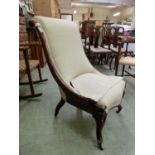 A Victorian mahogany nursing chair, over swept back on carved cabriole legs, upholstered in a