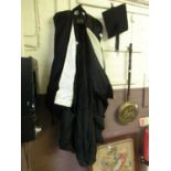 A Henry Wilson & Co of Cambridge graduation gown and cap