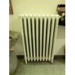 A cast iron radiator painted white