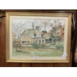 A framed and glazed watercolour of countryside cottage scene signed A Reeder
