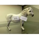 A Royal Doulton ceramic model of grey pony
