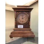 An early 20th century walnut cased mantle clock
