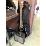 A Gear4music electro acoustic guitar along with a small amplifier by Gear4music