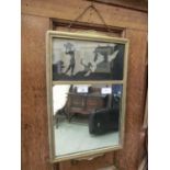 An early 20th century gilt framed mirror with silhouette panel to top