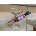 A Beswick ceramic figurine of pheasant in flight