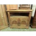 A pine corner standing television cabinet