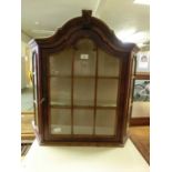 A reproduction dome topped wall hanging display cabinet