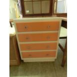 A white and orange painted four drawer chest