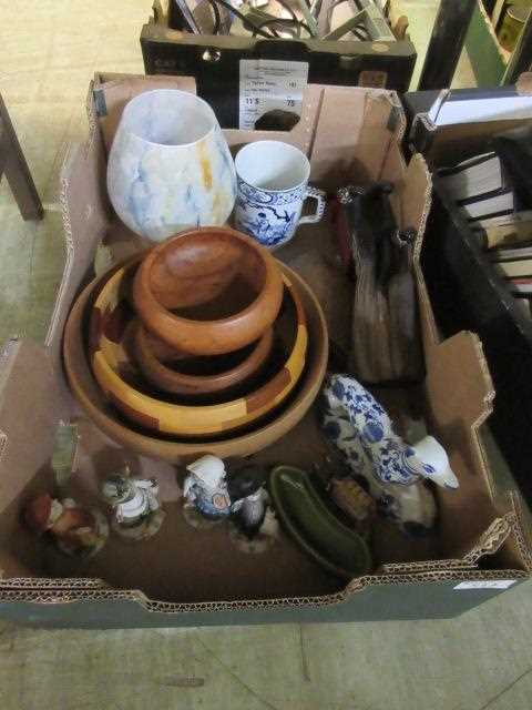 A tray of assorted items to include wooden bowls, Hummel figures, etc