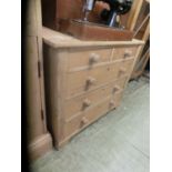 A pine chest of two short over three long drawersSplits and stains to top. Damage to some handles.