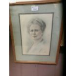 A framed and glazed coloured print of lady's head