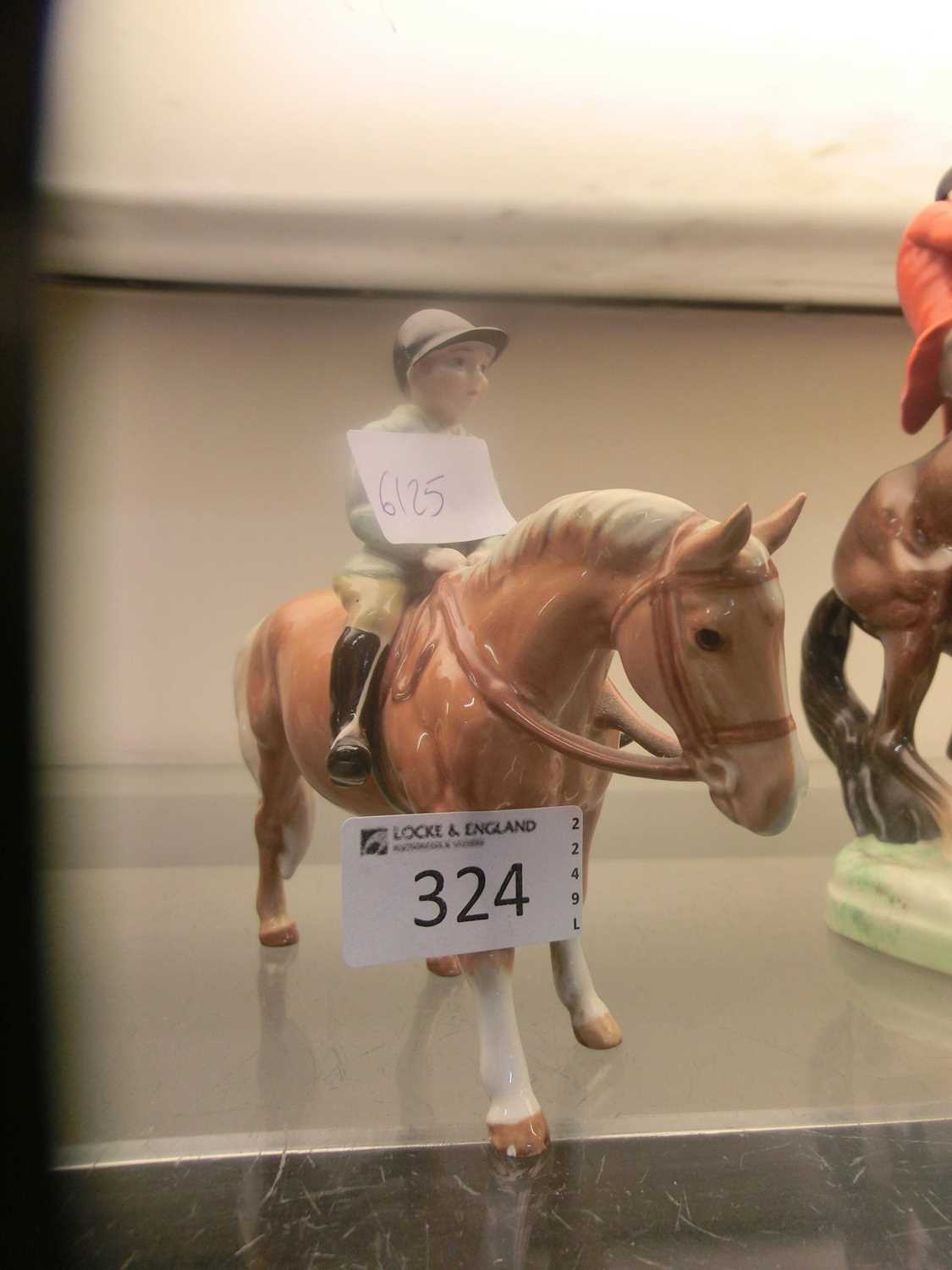 A Beswick figurine of hunting child on short horseSlight cracks to glaze. No apparent damage