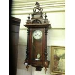 An early 20th century walnut cased Vienna style drop dial wall clock (Vendor states the clock is