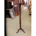 An early 20th century mahogany torchere stand