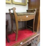 An early 20th century mahogany and boxwood strung music stool