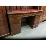 A 19th century mahogany twin pedestal desk with tooled red leather insert to top