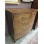 A mahogany veneered bow fronted chest of two short over three long graduated drawers