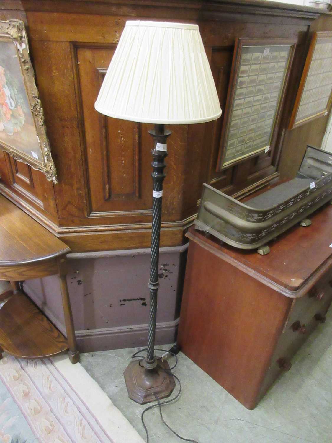 A reproduction twisted stemmed metal standard lampThe lamp is definitely made of metal. Unsure of