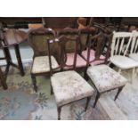 Three Victorian mahogany balloon back chairs together with Edwardian hall chairs