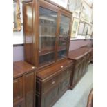 A Chinese hardwood cabinet having a pair of glazed doors to top, the base having two drawers above