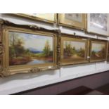 Three framed and glazed oleographs of countryside in gilt frames