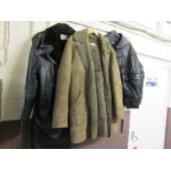 Two black simulated leather jackets together with a brown sheepskin coat