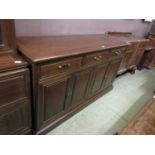 A Chinese hardwood dresser base having three drawers above cupboard doors