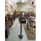 An early 20th century mahogany carved column standard lamp