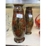 A pair of Royal Doulton glazed stoneware vases with autumnal leaf design