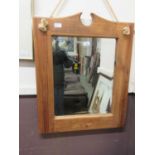 A pine wall mounted bevel glass mirror