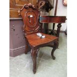 A 19th century mahogany shield-back hall chair