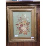 A framed and glazed artwork of dried flowers