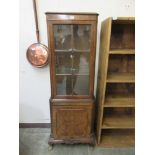 An early 20th burr walnut display cabinet