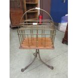 A 19th century brass and oak magazine rack