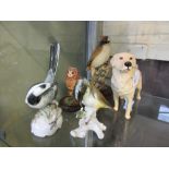 A selection of moulded and ceramic animal figurines to include Beswick golden retriever, Rosenthal