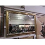 A gilt framed bevel glass mirror