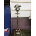 A brass and copper table lamp in the form of a street light