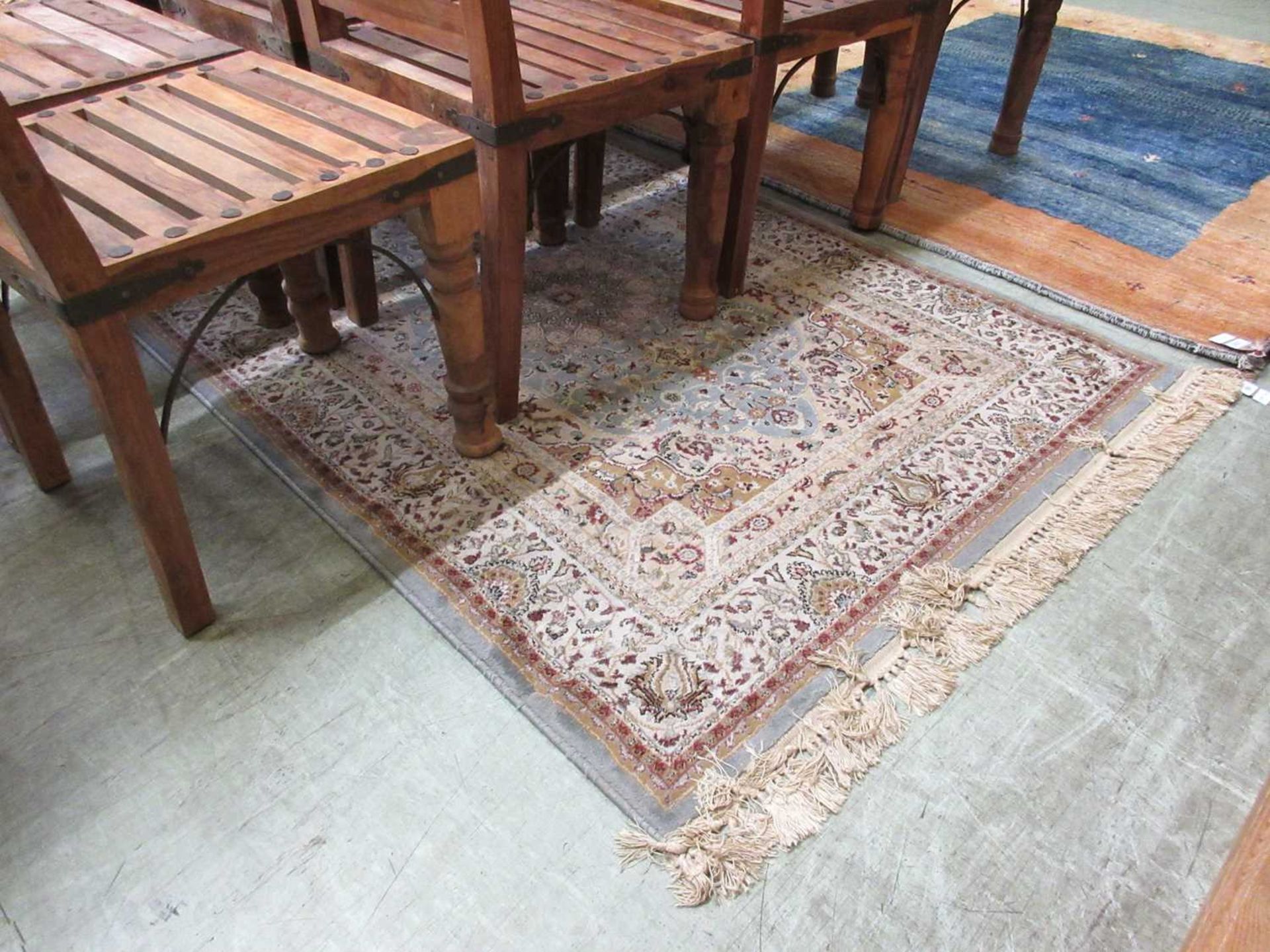 A blue ground Persian style rug