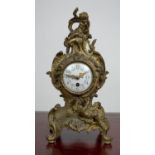 MANTLE CLOCK, 19th century French Rococo, enameled face with scrolling putti adorned bronze case,