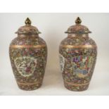 GINGER JARS, a pair, profusely decorated with butterflies and figural garden scenes with lids,