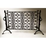 FIREDOGS/FENDER, wrought iron with two fire dog ends and suspended grillwork fender, 141cm x 79cm H.