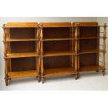 OPEN BOOKCASES, early 19th century, satinwood, a set of three, each with four shelves and turned