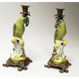 PARROT CANDLESTICKS, a pair, Continental style porcelain, in the form of perched parrots with